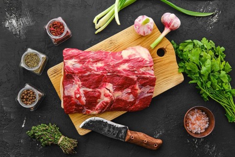 Raw fresh beef chuck center roast with spice and herbs