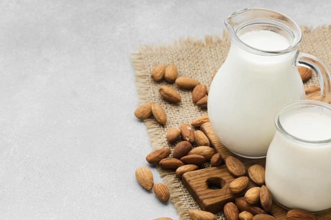 Close up fresh milk almonds with copy space