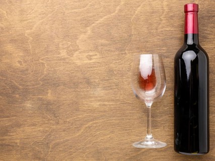 Flat lay wine bottle glass with copy space