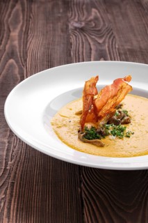 Mashed pumpkin soup puree with bacon