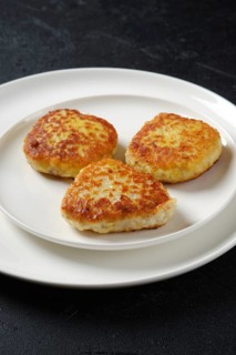 Fried squid cutlet in breading on a plate