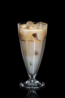 Cream and coffee ice cocktail isolated on black