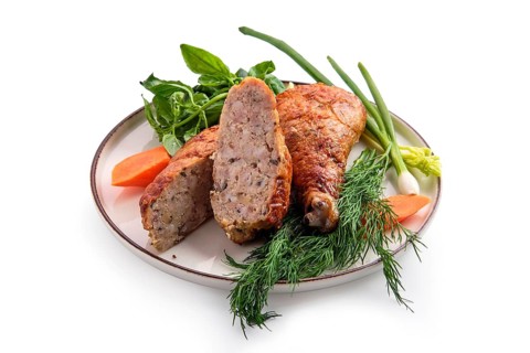 Stuffed chicken thigh decorated with spring onion