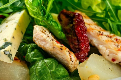 Macro photo of salad with roasted turkey