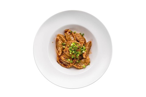 Deep-fried japanese gyoza or dumplings snack with soy sauce isolated on white background