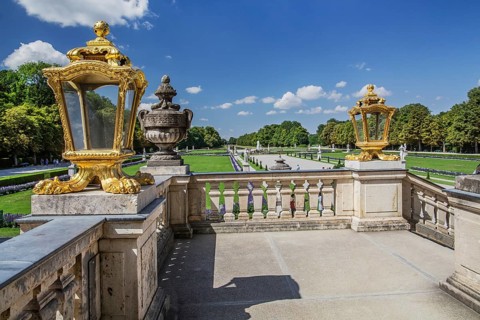 Staircase at the palace with view to the baroque garden parterre in the palace park