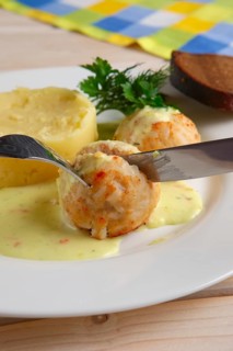 Closeup view of plate with meatballs and mashed potato