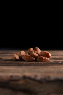 Almonds on the wooden background