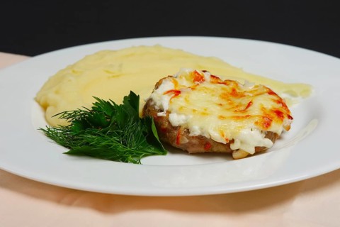 Plate with meat cutlet with cheese and mashed potato