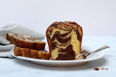 Marble cake with cake fork on plate
