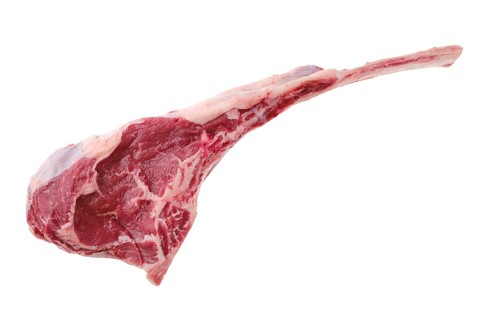 Overhead view of raw beef cowboy steak