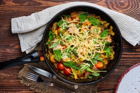 Top view of beef and vegetables stir fry on wooden table