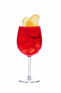 Cold sangria in a wine glass isolated on white background