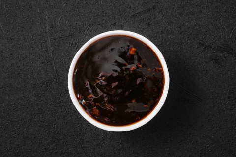 Overhead view of small bowl with spicy teriyaki sauce