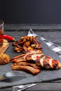 Fried pork fillet with mushrooms and slices of bacon served with pepper moonshine. Unhealthy but so tasty country food
