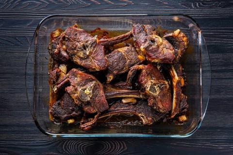 Top view of lamb meat baked in oven