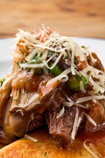 Macro photo of forest mushroom sauce on top of the food