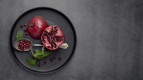 Top view plate with mint pomegranate. Resolution and high quality beautiful photo