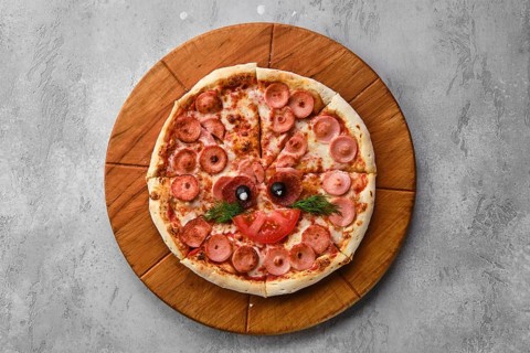 Top view of pizza for kids with sausage and cheese