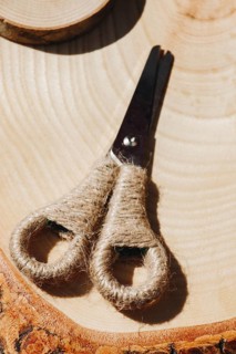 Metal scissors with wool handle in the view