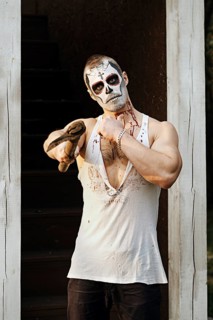 Male daemon with axe near firewood placing. Face painting art