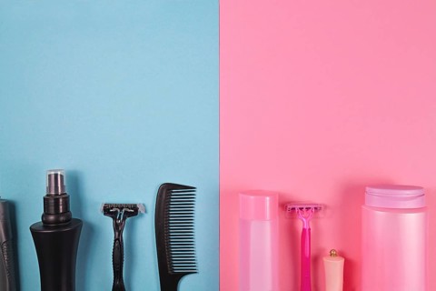 Gender tax and stereotypes concept for products marketed toward women to be more expensive than those marketed for men showing various pink and black personal care and hygiene products like shower gel