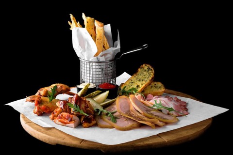 Big set of snack for beer on black background