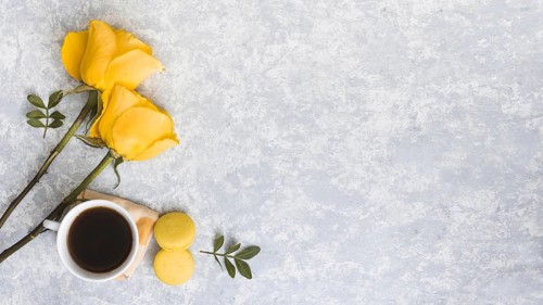 Rose flowers with macaroons coffee cup