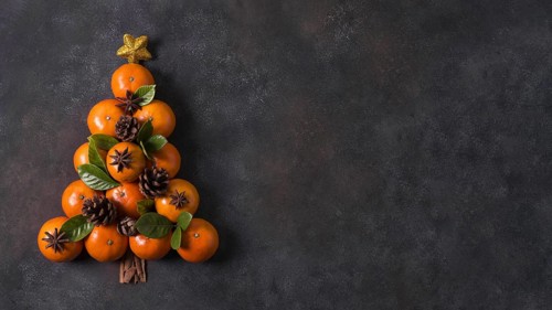 Top view of christmas tree shape made of tangerines and pine cones with copy space. Resolution and high quality beautiful photo