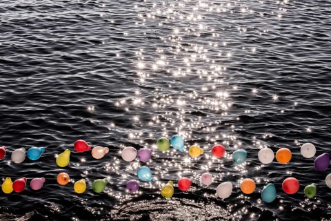 Balloon on a string on water for shooting game
