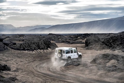 White Land Rover on a dirt road