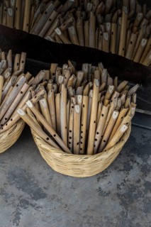 Dozens of handmade wooden flutes in the view