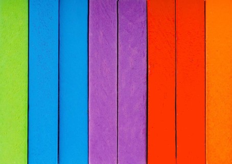Colorful Domino Blocks in a line on a white background