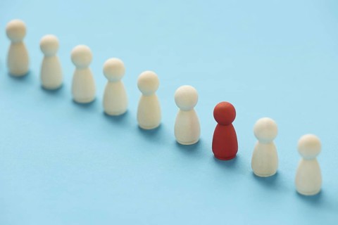 Red pawn surrounded by white ones. Resolution and high quality beautiful photo