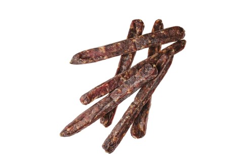 Top view of dried jerked deer and pork sausage isolated on white background