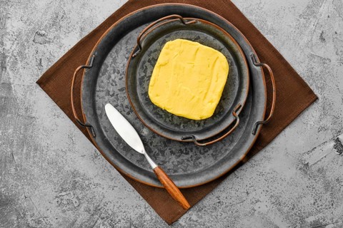 Homemade rustic butter and a spreading knife
