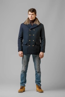 Full length portrait of handsome man in warm winter coat posing in studio