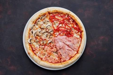 Top view of pizza four seasons with mushrooms