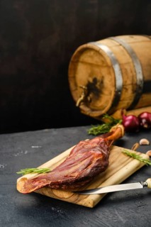 Air dried lamb meat on wooden cutting board