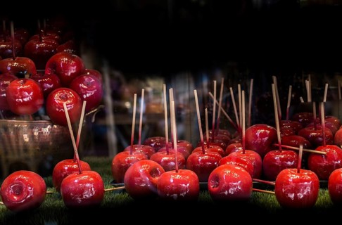 Candy apples are whole apples covered in a hard toffee or sugar candy coating