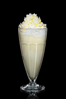 Banana milk cocktail with whipped cream