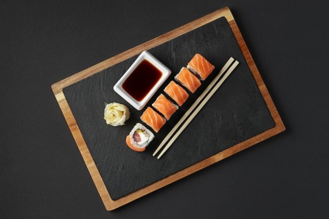 Rolls with salmon and tuna on stone plate