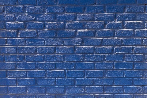 Copy space front view blue brick wall