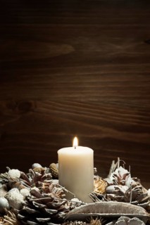 White candle lit with pine cone ornaments. Resolution and high quality beautiful photo