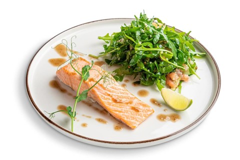 Steamed salmon with arugula and shrimps garnish