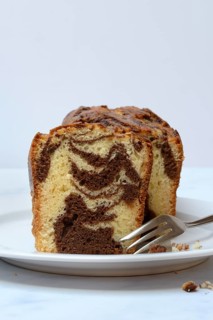 Marble cake with cake fork on plate
