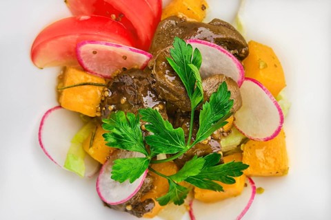 Macro photo of salad with fried chicken liver