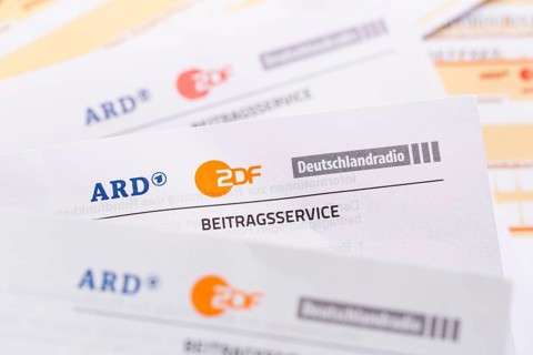 Contribution service of ARD and ZDF Rundfunkgebuehr GEZ with remittance slip in Stuttgart