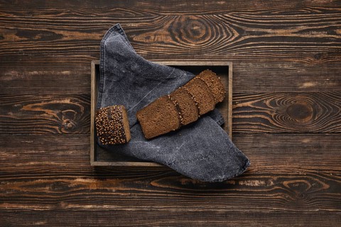 Fresh rye brown bread on wooden cutting board