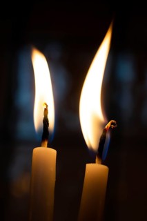 Burning candle making light in view